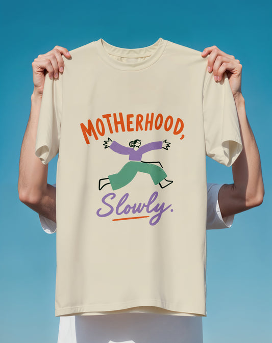Motherhood Slowly Graphic T-Shirt Funny Mom Shirt, Playful Illustration & Slogan
